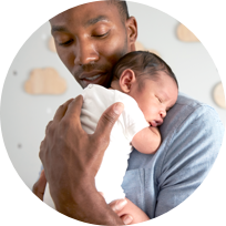 A dad holding his baby