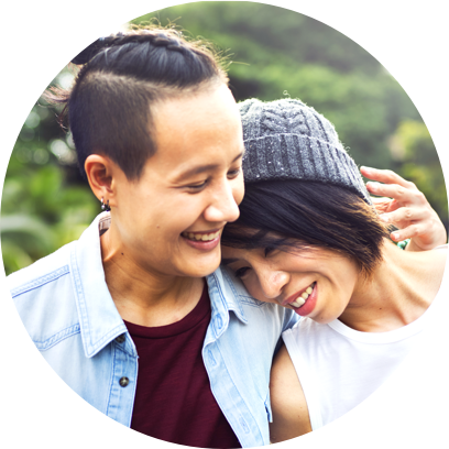 Two women leaning on each other